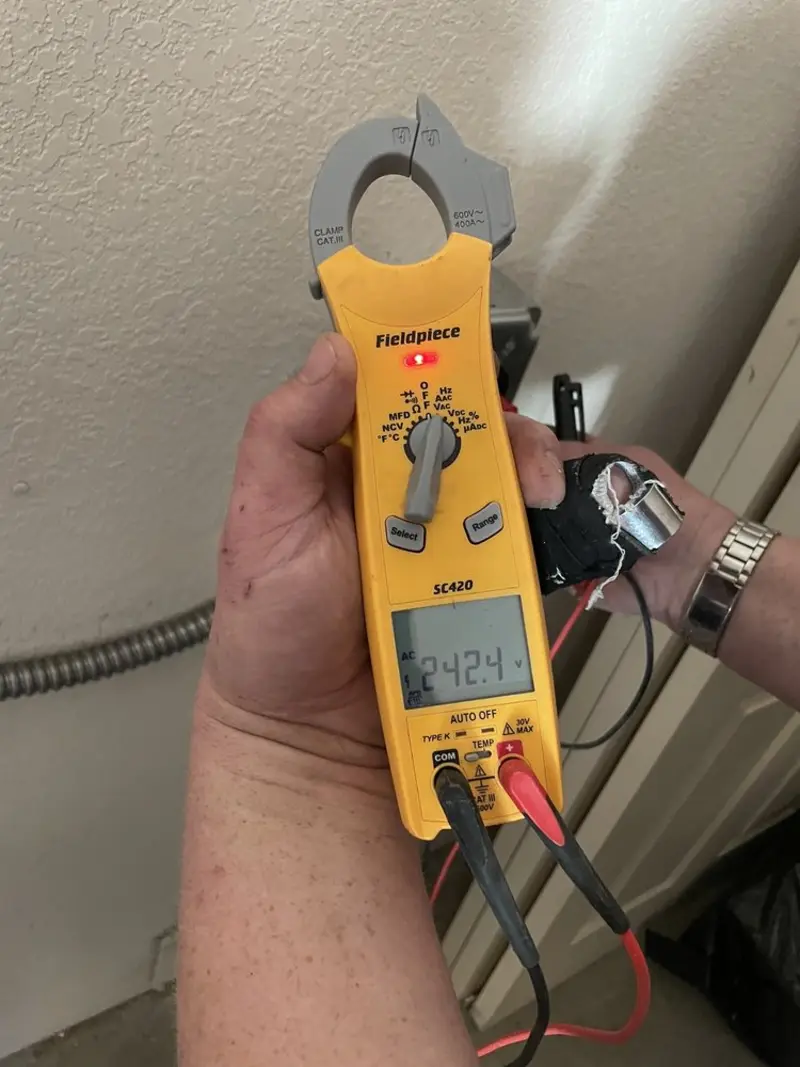 Voltage testing with clamp meter during Recessed Lighting Installation in Semmes